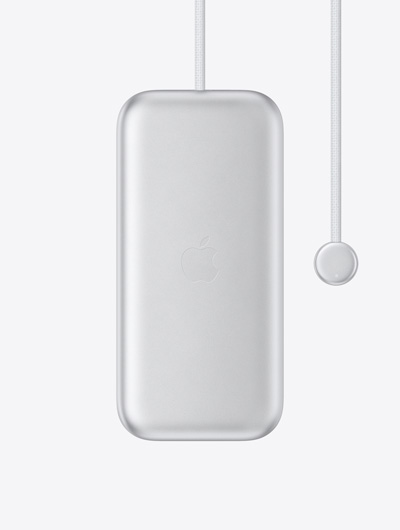Apple Vision Pro 電池外觀，Apple 標誌位於中央，內建電源連接線的一端具有圓形連接器，連接器上有 LED 指示燈